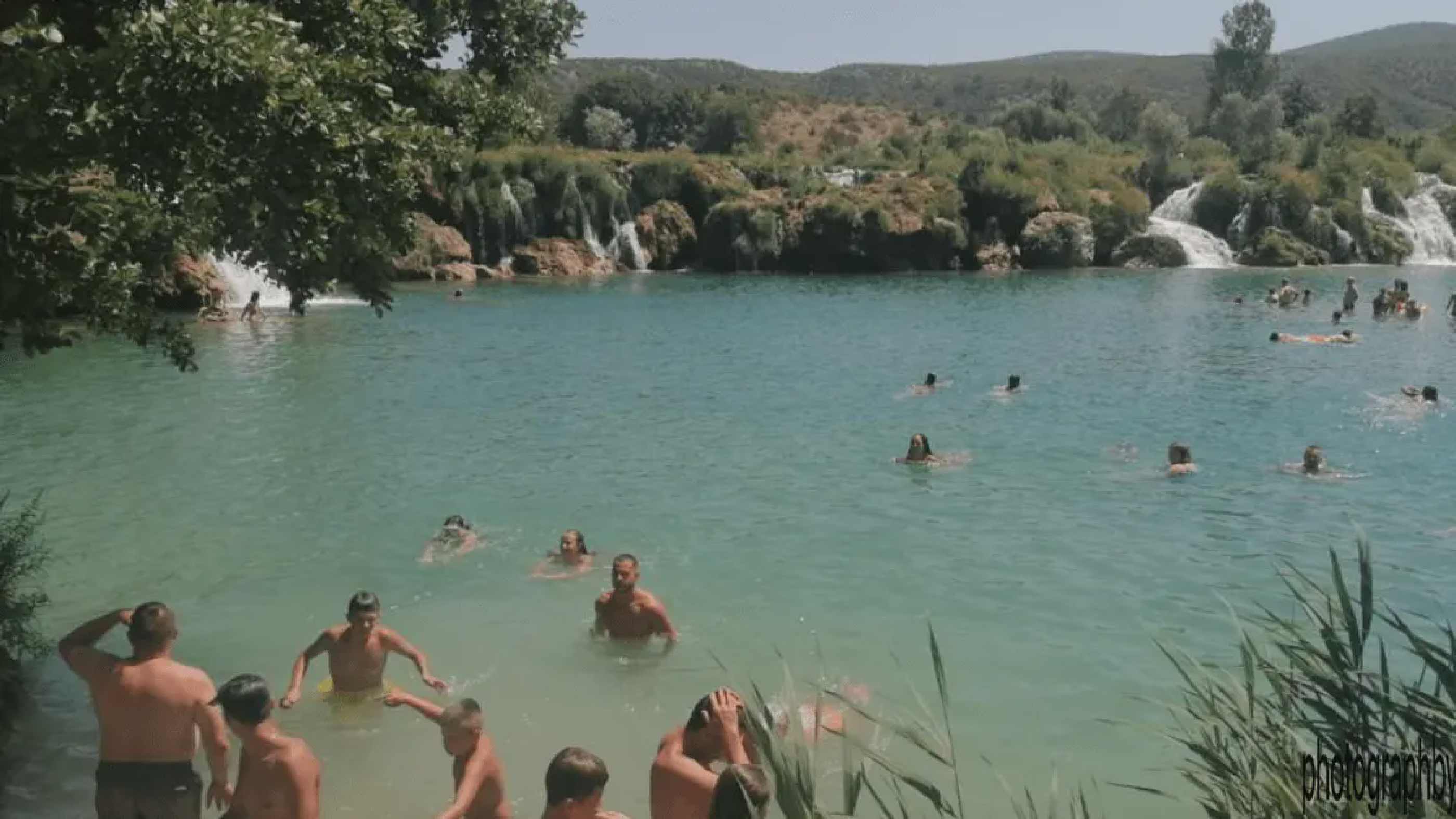 Swimming around and under the waterfall
