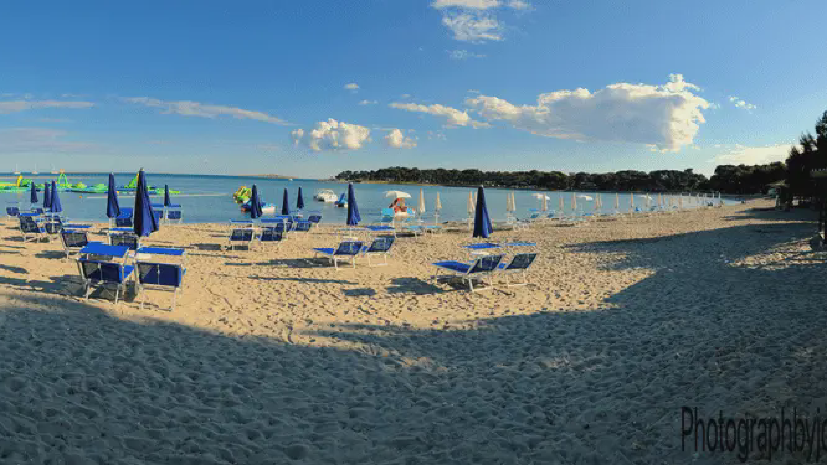 Aerial view of Medulin beach at golden hour with turquoise water