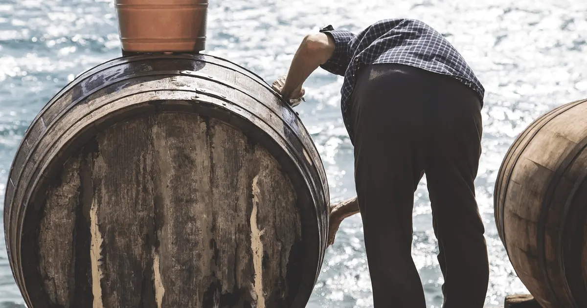 Old man with wine barrel